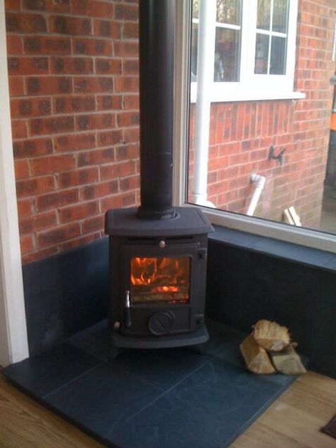 Wood burner in the corner Conservatory Wood Burner, Small Orangery Extension, Corner Log Burner, Small Orangery, Orangery Ideas, Conservatory Conversion, Free Standing Wood Stove, Small Log Burner, Wood Burning Stove Corner