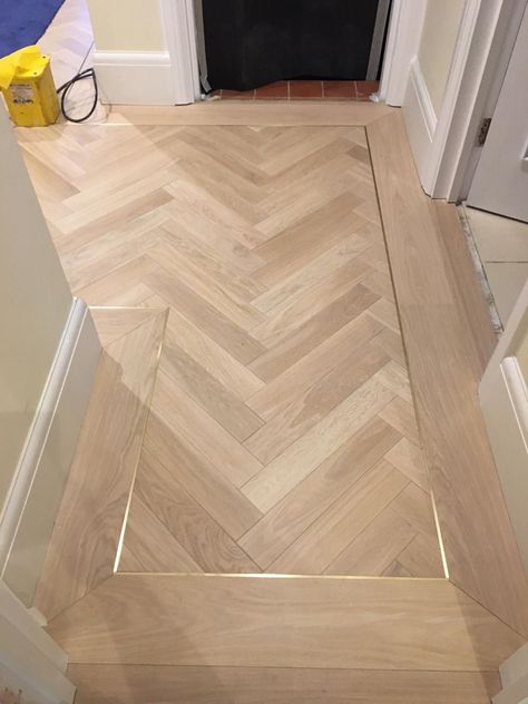 Herringbone Inlay Floor, Chevron Hallway Floor, Herringbone Wood Floor With Gold Trim, Tile Floor With Wood Inlay, Herringbone And Straight Wood Floor, White Oak Chevron Floor, Wood Herringbone Floor Bathroom, Mosaic Flooring Ideas, Wide Plank Herringbone Wood Floor