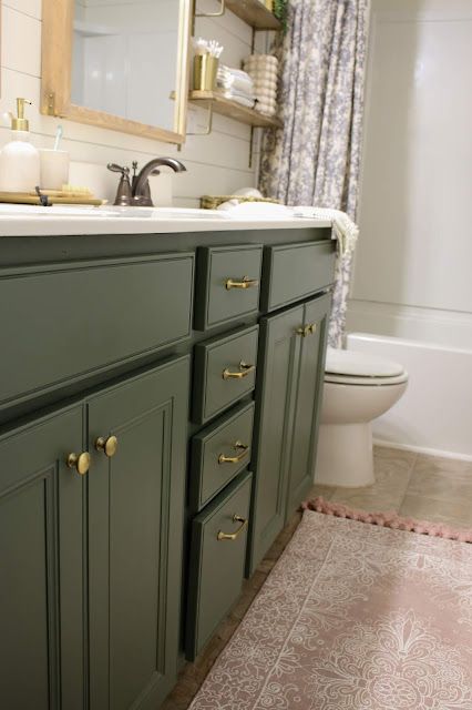 A budget-friendly bathroom makeover that doesn't include tile or a new floor! Tan Floor Tile Bathroom, Green Bathroom Cabinet Colors, Green Tan Bathroom, Bathroom With Tan Tile Floor, Bathrooms With Tan Tile, Classic Bathroom Remodel Ideas, Bathroom Paint Colors With Tan Tile, Bathroom Tan Tile, Bathroom With Tan Tile