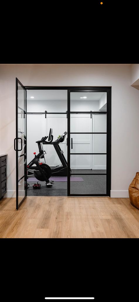 Glass Wall Gym Design, Basement Gym Glass Door, Basement Gym Doors, Basement Gym Room, Home Gym Glass Doors, Gym Glass Door, Basement Gym And Family Room, Basement Exercise Room, Small Basement Gym