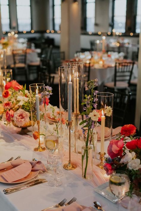 modern wedding colorful florals and candles | Image by Elvira Kalviste Long Table Decor For Wedding, Wedding Table Centerpieces Summer, Summer Wedding Ideas Indoor, Wedding In August, August Wedding Decorations, Pink And Green Tablescapes, Wedding Simple Table Decor, Indian Tablescape, Wildflower Wedding Theme Table Settings