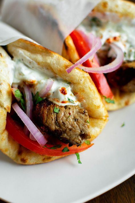 Seriously good-tasting Pork Souvlaki (skewers). Wrapped inside pita flatbread along with thick and creamy Tzatziki tomatoes and onions. #Souvlaki #Greek #Wraps #Pitabread Greek Beans, Souvlaki Pita, Pita Wraps, Souvlaki Marinade, Pork Souvlaki, Pork Gyros, Pita Flatbread, Beans Soup, Lemon Jam