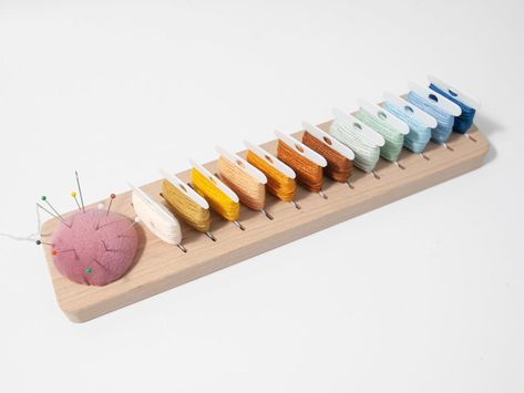 PRICES MAY VARY. Our floss bobbins organizer is made of sturdy and durable beech wood with a smooth sanded surface Our floss organizer boasts 12 positions, providing ample space for your embroidery floss bobbins. The thoughtful design allows you to categorize and arrange your threads systematically, making your crafting process more efficient. Convenient pin cushion provide a safe place to store needles and pins.keeps your pins and needles safe and within reach Exceptional Value - Spend less tim Embroidery Floss Organizer, Embroidery Floss Storage, Floss Bobbins, Floss Organizer, Needle Organizer, Hobby Storage, Embroidery Bobbins, Sewing Supplies Storage, Sewing Studio