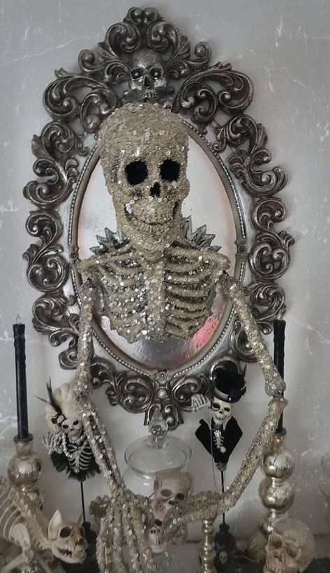 a mirror in a whimsical vintage frame, with a glitter and sequin skeleton coming out of it is a super glam and chic decor idea for Halloween Halloween Mirror, Tattoo Skulls, Soya Mumu, Creepy Halloween Decorations, Katherine's Collection, Adornos Halloween, Chic Halloween, Halloween Crafts Decorations, Whimsical Halloween