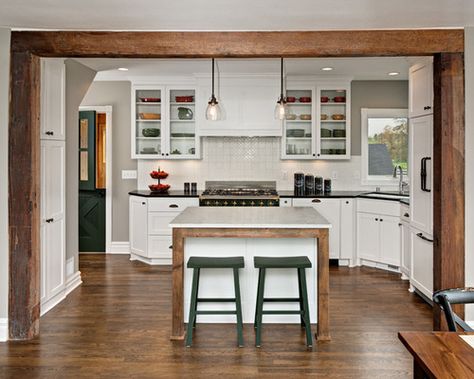 Inspiration for a mid-sized farmhouse l-shaped open concept kitchen remodel in Minneapolis with an undermount sink, shaker cabinets, white cabinets, white backsplash, dark hardwood floors, an island, soapstone countertops, ceramic backsplash and paneled appliances Exterior Home Renovation, Ceramic Backsplash, Stainless Steel Farmhouse Sink, White Farmhouse Sink, Painted Brick Walls, Soapstone Countertops, Kitchen Improvements, Dark Hardwood, Concept Kitchen