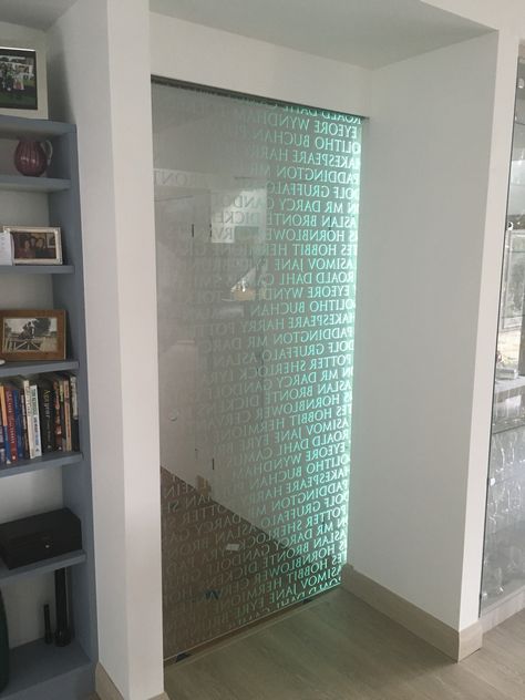 A unique literary design for a home library with edge lit led lighting Glass Doors Sliding, Edge Lit Acrylic, Glass Showers, Leaded Glass Door, Shower Screens, Etched Mirror, Led Signage, Smart Glass, Sliding Glass Doors