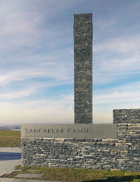 A tower of plain slate stands as the lone beacon to Sancaklar Mosque in Istanbul, a unique mosque which breaks away from the conventions of religious design in Turkey.  Designed by Emre Arolat Architects (EAA) and built in 2011.  Photo by Erdoğan Akman, via Flickr. Unique Mosque, Sancaklar Mosque, Mosque Modern, Monument Signage, Dorm Design, Mosque Design, Site Sign, Sacred Architecture, Tadao Ando