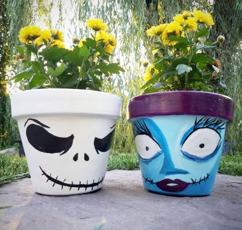 These Hand Painted Nightmare Before Christmas Flower Pots Are Simply Meant To Be Mine Painting Flower Pots Ideas, Flower Pots Ideas, Painting Flower Pots, Jack Y Sally, Pots Ideas, Nightmare Before Christmas Decorations, Flower Pot People, Clay Pot People, Flower Pot Art