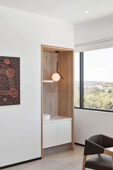 Luxurious, minimalist comfort overlooking an ocean of sun-drenched eucalyptus canopies. When you’ve got a view like this, why make anything else the focus. This was the starting point for this high-end scandi clinic that invites the view inside for their medical fitout. 
The Queensland Orthopaedic Clinic balances modern and natural, and clinical and familiar for a confidently luxurious medical fitout result. Consulting Room, Medical Furniture, Clinic Interior, Medical Office Design, Healthcare Architecture, Cabinet Medical, Gym Interior, Clinic Interior Design, Hospital Interior