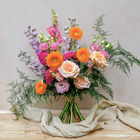 Colourful fresh flowers bouquet with purple delphinium, orange gerbera and ppink snadragon Bouquet Colour Palettes, Colour Bouquet, Colourful Wedding Flowers, Garden Style Bouquet, Summer Flower Bouquet, Congratulations Flowers, Multicolor Wedding, Wild Meadow, Colorful Wedding Flowers