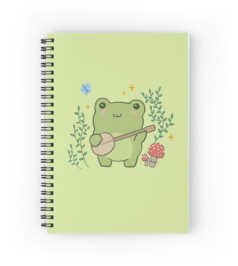 Spiral notebooks with high-quality edge-to-edge print on front. 120 pages in your choice of ruled or graph lines. Cottagecore aesthetic frog playing banjo guitar to the blue butterfy, with mushrooms, stars and nature. Unique gift for frog lover, toad lover, amphibian owner, animal lover, cottagecore aesthetic style fan, nature lover. Frog Playing Banjo Drawing, Frog Guitar, Frog With Banjo, Frog Notebook Cover, Frog Playing Banjo, Frog Gifts, Stylist Tattoos, Cottagecore Aesthetic, Cute Frogs