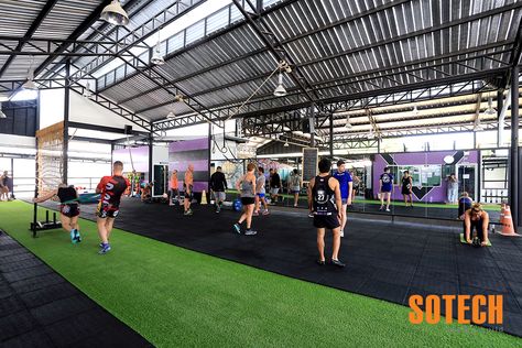 Sotech designed and built the latest gym on Phuket named Unit 27, who is a purpose built, specialized strength conditioning and an official CrossFit affiliate gym based in Chalong. This is a 1,000 square meters semi open air gym with a unique 9 meters climbing tower, uphill running track, air-conditioned spinning bikes room, air-conditioned cardio room, sauna and even two ice baths. www.sotech-asia.com Open Air Gym Design, Rooftop Gym, Container Gym, Industrial Gym, Sports Training Facility, Commercial Gym Design, Fitness Center Design, Sports Facility, Gym Design Interior