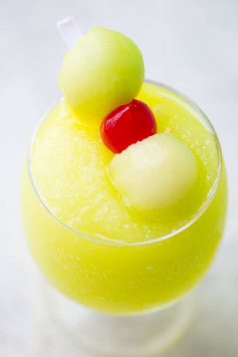 Spiked Melon Ball Slushies: A frozen twist on the classic melon ball drink made with freshly frozen Honeydew, melon liquor, melon vodka, and sweet pineapple juice. Frozen Mimosa Recipe, Melon Ball Drink, Frozen Mimosa, Watermelon Balls, Melon Balls, Collage Recipes, Trail Mix Recipes, Mimosa Recipe, Frozen Watermelon