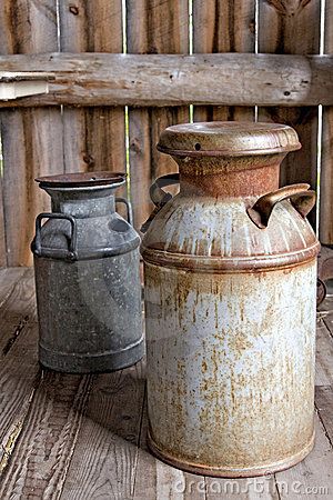 Rusty Milk cans by Mellimage, via Dreamstime Old Milk Bottles, Painted Milk Cans, Antique Milk Can, Old Milk Cans, Vintage Milk Can, Churning Butter, Metal Containers, Farms Living, Rusty Metal