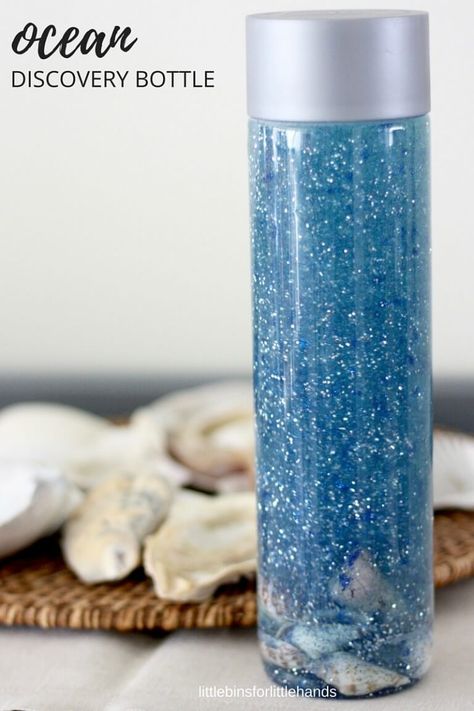 Ocean discovery bottle summer sensory activity for kids Ocean Science Activities, Calming Jars, Ocean Sensory, Ocean Bottle, Ocean Theme Preschool, Calm Down Bottle, Discovery Bottles, Sensory Bottle, Preschool Science Activities