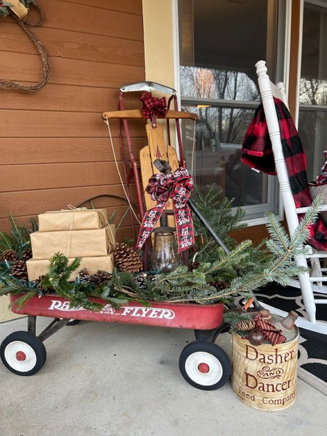 Christmas Wagon Ideas, Sled Decorating Ideas Porch, Wagon Wheel Christmas Decor, Christmas Wagon Decor, Radio Flyer Wagon Christmas Decor, How To Decorate A Wagon For Christmas, Christmas Wheelbarrow Ideas, Old Wagon Christmas Decor, Christmas Wagon Wheel