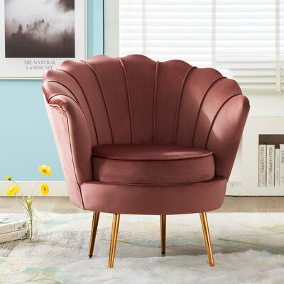 The barrel chair features a seashell-inspired back and gold-finished legs for some contemporary glam style in your living room or den. It has a solid and engineered wood frame, resting on four metal legs for a bit of shining contrast. This chair showcases velvet upholstery to give your space a luxe look, while foam-filled cushioning provides extra support when you're curled up with a good book or enjoying some late-night TV. Vertical channel tufting and distinctive piping round out this modern p Luxury Single Sofa, Single Couch, Sofa Arrangement, Lounge Chair Bedroom, Living Room Furniture Styles, Velvet Lounge Chair, Minimalist Sofa, Muebles Living, Relaxing Chair