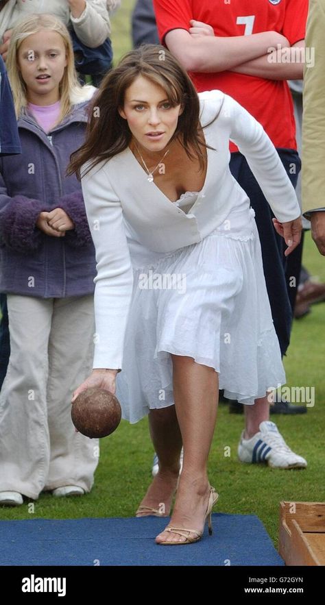 Download this stock image: Elizabeth Hurley tries skittles after opening Ampney Crusis Fete. - G72GYN from Alamy's library of millions of high resolution stock photos, illustrations and vectors. Elisabeth Hurley, Elizabeth Hurley, Fashion Tights, Image Processing, Celebrity Entertainment, Beautiful People, High Resolution, Tights, Stock Images