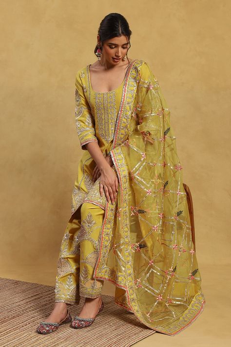 Yellow kurta with all over floral, vintage pattern, contrast metallic gota, thread, bead and zari embroidery. Paired with embroidered salwar and dupatta with cut work lace border. - Aza Fashions Embroidered Salwar, Dupatta Style, Yellow Kurta, Clothing Store Interior, Indian Princess, Kurta Pant Set, Velvet Dress Designs, Zari Embroidery, Punjabi Outfits