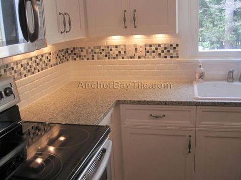 White subway tile with mosaic inlay Backsplash With Accent Strip, Beveled Subway Tile Kitchen, Subway Tiles Kitchen, Subway Tile Kitchen Backsplash, White Beveled Subway Tile, Tiles Kitchen Backsplash, Mosaic Tile Backsplash Kitchen, Tile Kitchen Backsplash, Beveled Subway Tile