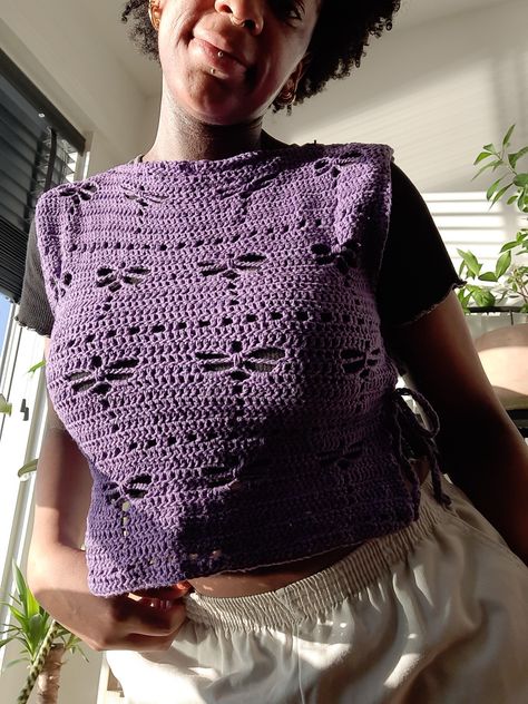 Purple crochet dragonfly sweatervest with side ties #crochet #purpledragon #dragonflies Dragonfly Crochet Top Pattern Free, Things To Crochet With Purple Yarn, Dragonfly Crochet Top, Dragonfly Crochet Pattern Free, Dragon Fly Crochet, Crochet Dragonfly Pattern, Purple Crochet Top, Dragonfly Crochet, Crochet Dragonfly