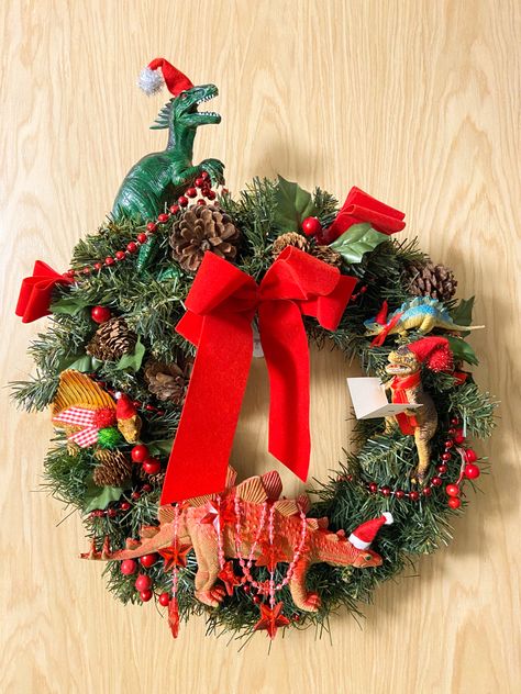 Dinosaur Christmas wreath Dinosaur Wreath Ideas, Dinosaur Wreath, Dino Crafts, Dinosaur Christmas Decorations, Dino Christmas, Toy Dinosaurs, Dinosaur Christmas Tree, Dinosaur Christmas Ornament, Xmas Inspiration