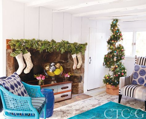 Whimsical colors and modern moments fill this very happy home. Christmas Garland Fireplace, Garland Fireplace, Orchid Wallpaper, Good Earth India, White Urn, Joanna Buchanan, Cane Back Chairs, Festive Tablescape, Acrylic Chair