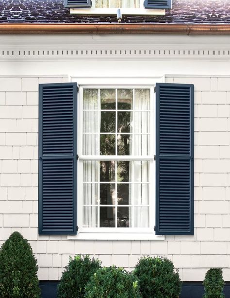 White House Dark Gray Shutters, Linen Color Siding Exterior, White Colonial Blue Shutters, Grey House Shutters, Light Grey Siding House With Shutters, Shutters On Cream House, Shutter Paint Colors Exterior, White Siding With Shutters, House And Shutter Color Combos