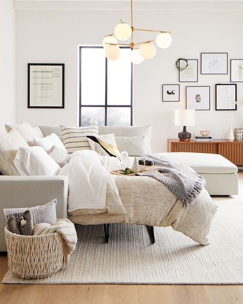 West Elm | Furniture + Decor on Instagram: “Got guests? We've got you! From sleeper sofas to extra bedding, pillows and throws, get everything you need to get #guestready through the…” West Elm Harmony Sectional, Gray And Wood Living Room, West Elm Living Room Ideas, Light And Airy Living Room, West Elm Living Room, Minimal Living Room Decor, Modular Ottoman, Light Gray Couch, West Elm Furniture