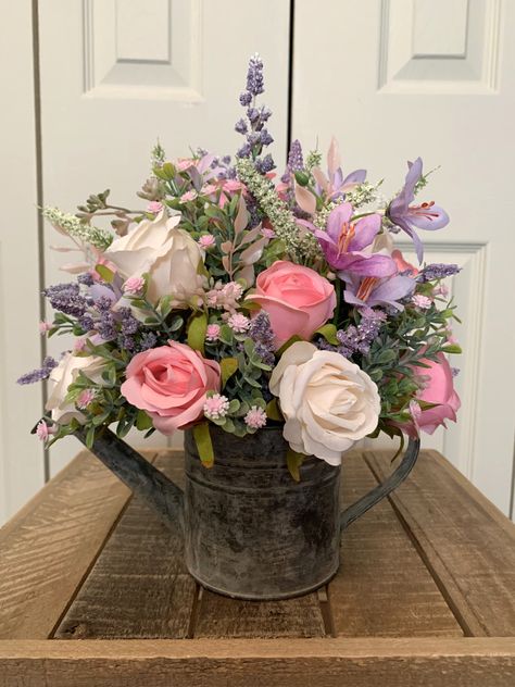 This beautiful arrangement features pink and ivory roses...perfect addition to your spring/summer decor. Water Can Floral Arrangements, Watering Can Floral Arrangements, Flower Shop Decor, Spring Flower Arrangements, Metal Watering Can, Artificial Floral Arrangements, Watering Cans, Ivory Roses, Spring Summer Decor