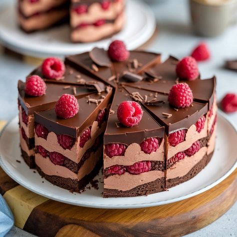 Rich chocolate cake layered with sweet raspberry filling and topped with a smooth chocolate ganache – this Chocolate Raspberry Cake is pure indulgence! 🍫🍰🍇 Ingredients:** **For the Cake:** - 1 3/4 cups all-purpose flour - 3/4 cup unsweetened cocoa powder - 1 1/2 teaspoons baking powder - 1 1/2 teaspoons baking soda - 1/2 teaspoon salt - 1 3/4 cups granulated sugar - 1/2 cup vegetable oil - 2 large eggs - 2 teaspoons vanilla extract - 1 cup buttermilk - 1 cup hot water - 1 cup fresh raspberr... Chocolate Cake With Raspberry Filling, Chocolate Raspberry Cake, Unsweetened Cocoa Powder, Rich Chocolate Cake, Candy Cakes, Dark Chocolate Cakes, Raspberry Filling, Food Menu Design, Raspberry Cake