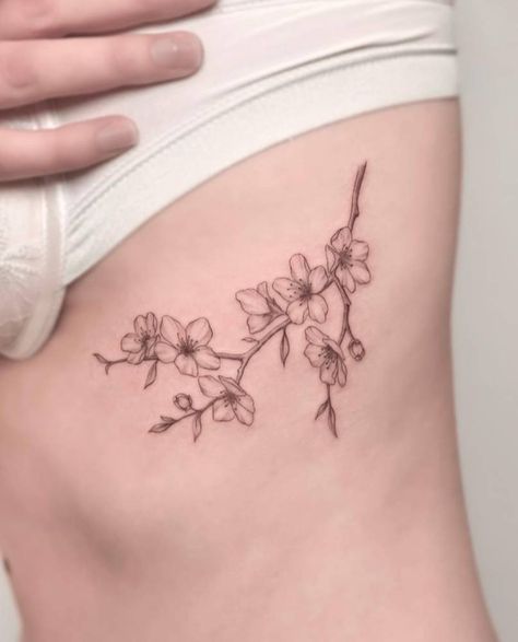 Tattoos Cherry Blossom, Spine Cherry Blossom Tattoos, Rib Cherry Blossom Tattoo, Cherry Blossom Hip Tattoo, Simple Cherry Blossom Tattoo, Cherry Blossom Spine Tattoos For Women, Cherry Blossom Rib Tattoo, Sampaguita Tattoo, Cherry Blossom Tattoo Side Ribs