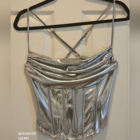 Shop ninam337's closet or find the perfect look from millions of stylists. Fast shipping and buyer protection. NWT---Sincery Jules Metallic Corset-Style, Size Small. Corset Crop Top by Sincerely Jules is perfect for a date night, a party, or even going on a cruise. It is that type of top. This is new with tag. This two-piece is a show stopper. The color is vibrant and beautiful. ******** New with Tag Brand: Sincerely Jules Size: Small Pit to pit: 15" (laying flat) Adjustable str Silver Crop Top Outfit, Metallic Top Outfit, Silver Corset Top, Metallic Corset, Small Corset, Silver Corset, Silver Crop Top, Going On A Cruise, Metal Outfit