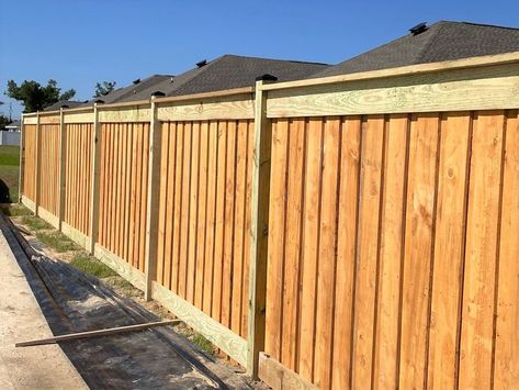 Board on Board Wood Fence with Top and Bottom Trim and Top cap completed by Shannon and his crew in Callaway. Board on Board Wood Fence is constructed with an overlapping pattern of pickets where every board is on the same side of the rail, but every other picket overlaps the first layer of wood pickets. Board on Board Wood fences offer complete privacy. In that case, if security is important to you, a Board on Board Wood Fence gives you the security you need. Board On Board Fence Ideas, Diy Board On Board Fence, Board On Board Fence Gate, Wood Fence Privacy Ideas, Diy Wood Privacy Fence, Board On Board Privacy Fence, Wood Privacy Fence Ideas, Wooden Privacy Fence Ideas, Brushwood Fence