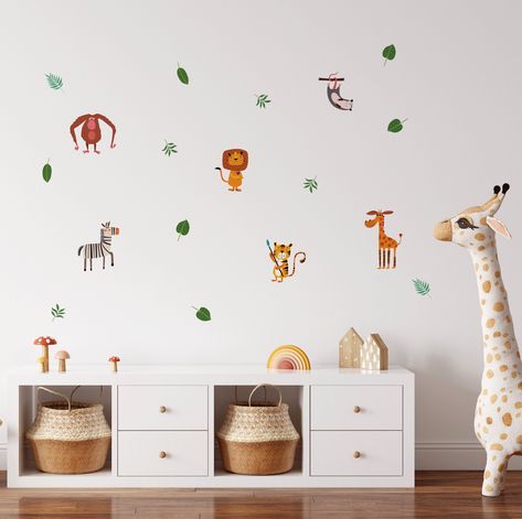 Beautiful safari animal wall stickers. Add the perfect safari theme to your kids rooms in minutes! 
 Simply peel & stick to apply. Pack contains 6 different animal wall stickers/decals, and 12 tropical wall sticker leaves. 
 Easy to apply, removable, affordable. Perfect safari animal wall decal stickers for rented properties. 
 SIZING 
Safari wall stickers vary in size, from approx 5 cm - 20 cm. You will receive 3 x A4 sized separate sheets of stickers. 
 Easy to apply, removable, affordable Tropical Wall Decals, Safari Animal Wall Decals, Animal Wall Stickers, Boys Wall Stickers, Kids Bedroom Boys, Zebra Wall Art, Zebra Wall, Boy Girl Nursery, Stickers Easy