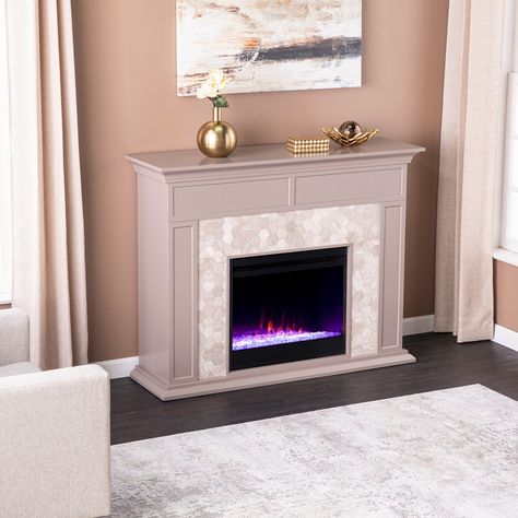 Modernize your media room with this gray and white marble fireplace. Hexagon shaped tile and authentic marble join together to craft a look that's both homey and elegant. Painting Electric Fireplace Tile, Tiled Electric Fireplace, Faux Stone Electric Fireplace, Stone Electric Fireplace, White Marble Fireplace, Indoor Electric Fireplace, Laundry Room Hacks, Marble Fireplace, Wall Mount Electric Fireplace