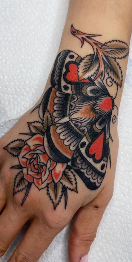 100 Hand Tattoos For Women With Style - Tattoo Me Now Falcon Hand Tattoo, Hand Tattoos For Women Japanese, Colourful Hand Tattoo, Hand Tattoo American Traditional, Large Hand Tattoos For Women, Trad Hand Tattoo, Traditional Hand Tattoos For Women, Women’s Hand Tattoos, Top Of Hand Tattoos For Women