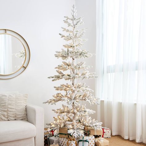 "Buy 7ft. Deluxe Pre-Lit Flocked Pine Artificial Christmas Tree, Warm White LED Lights at Michaels. com. This is a decorator's delight, thanks to open branches and natural pockets designed to showcase your treasured ornaments. This lifelike spruce gleams with more than 300 warm white microlight LEDs. A decorator's delight, thanks to open branches and natural pockets designed to showcase your treasured ornaments. This lifelike pine gleams with more than 400 warm white microlight LEDs. Tree style: Led Christmas Tree Lights, Faux Christmas Trees, Spruce Christmas Tree, Christmas Tree With Snow, Warm White Lights, Fir Christmas Tree, Pine Christmas Tree, Pre Lit Christmas Tree, Real Christmas Tree