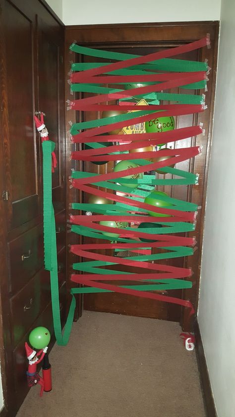 elf on the shelf streamer and balloon door barricade Elf On Shelf Streamers, Elf On The Shelf Ideas With Streamers, Elf On The Shelf Balloon Garland, Elf Streamers, Elf Debut Ideas, Elf On The Shelf With Balloons, Elf On The Shelf Streamer Ideas, Elf On The Shelf Door Decoration, Elf On The Shelf Door