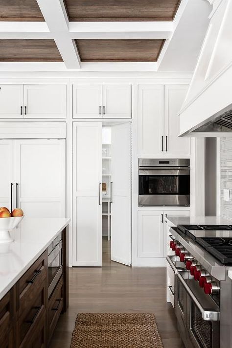 Hidden kitchen pantry concealed in a white shaker kitchen with orb pulls. Concealed Kitchen, Kitchens Modern, Secret Doors, Hidden Pantry, White Shaker Kitchen, Hidden Kitchen, White Shaker Cabinets, European Farmhouse, Kitchen Pantry Design