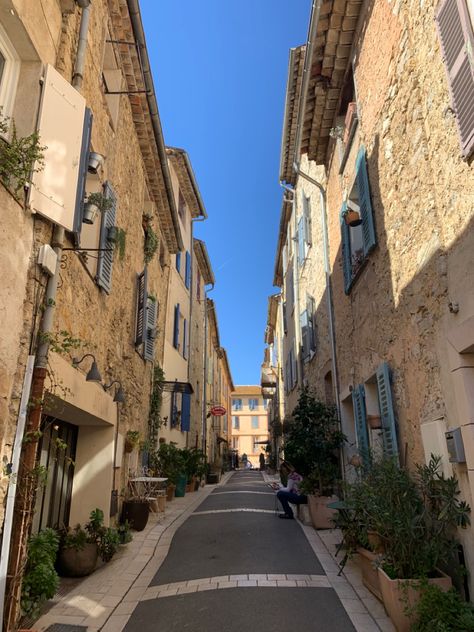 Old ton houses in a French village. Blue summer skies in France. Old rows of French stone houses in the south of France. Valbonne in-the cote d’Azur. Blue summer skies. Sunny spring day. French Town Aesthetic, French Neighborhood, Old French Aesthetic, French Summer Aesthetic, French Village Aesthetic, Valbonne France, Small French Village, Old French Town Aesthetic, France Town Aesthetic