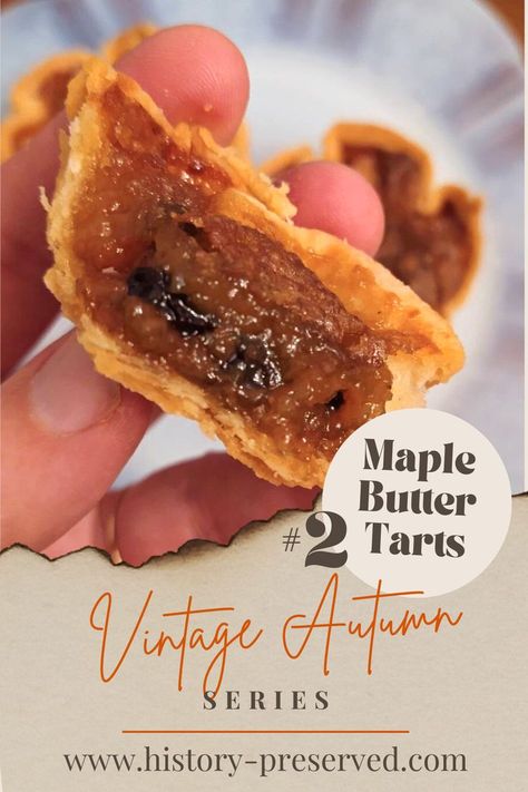 hand holding maple butter tart cut in half showing golden gooey filling with raisins and a flakey crust Maple Butter Tarts Recipe, Maple Syrup Butter Tarts, Butter Tarts With Maple Syrup, Maple Butter Tarts, Butter Tart Filling Recipe, Apple Butter Tarts, Butter Tarts Filling Recipe, Maple Tarts, Colonial Recipes