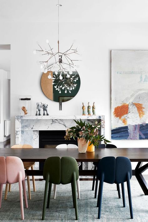 colourful dining chairs are styled around a dining table with art on the walls and fireplace mantel Melbourne Home, Melbourne House, Renovation Design, Walnut Dining Table, Hall Design, Colorful Chairs, Australian Homes, Interior Deco, Art Deco Interior