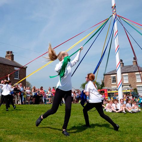 New Today -  What is a Maypole and Why Do People Dance Around It? metrogaragedoor.com International Workers Day, Village Fete, Workers Day, Pagan Rituals, Masculine Energy, People Dancing, Rain Barrel, Family Handyman, Beltane