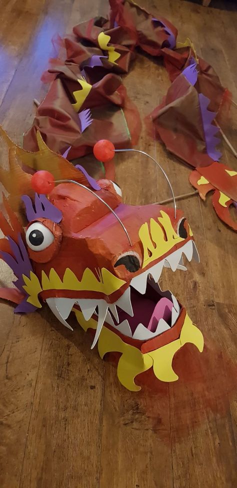 How To Make A Chinese Dragon, Chinese Dragon Dance Costume, Chinese Paper Dragon, Chinese Dragon Art Project, Chinese Dragon Costume Diy, Diy Chinese Dragon, Chinese Dragon Costume, Chinese Dragon Craft, Dragon Dance Costume