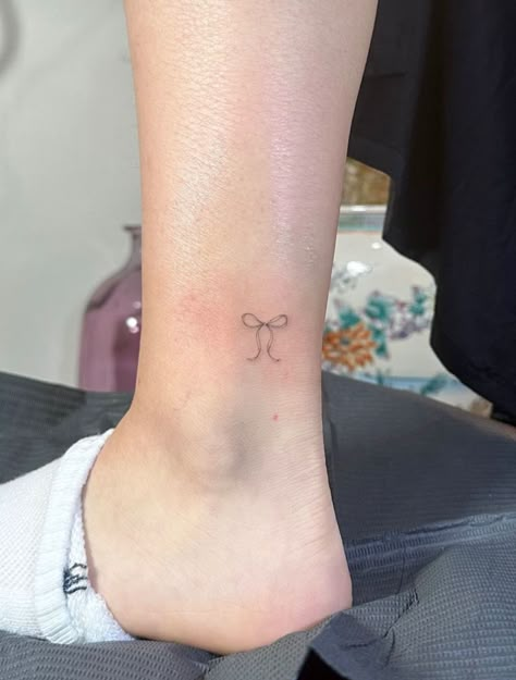 Dainty Dance Tattoos, Bow Tattoo On Ankle, Tattoos That Represent Femininity, Ankle Bow Tattoo, Bow Tattoo Meaning, Bow Ankle Tattoo, Cheer Bow Tattoo, Coquette Bow Tattoo, Bow Tattoo Placement