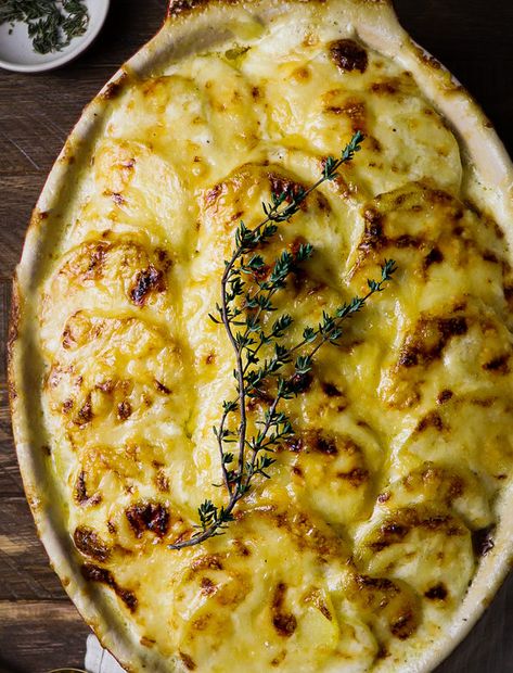 These rich and creamy Potatoes Dauphinoise are a classic French dish of thinly sliced potatoes cooked in heavy cream and baked with gruyère cheese making them Dophinoise Potatoes Recipe, Slow Roasted Beef Tenderloin, Potatoes Dauphinoise, Creamy Potatoes, French Potatoes, Fancy Dinners, Classic French Dishes, Potato Recipes Side Dishes, Classic Recipes