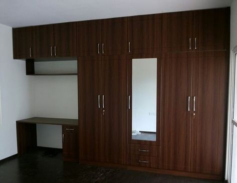 Wooden finished wall to wall wardrobe for bedroom design with study unit, perfect for storage space of cloth set. . . . . #cloth #set… Veneer Wardrobe Design Bedroom, Wall To Wall Wardrobe, Veneer Wardrobe Design, Brown Cupboard, Veneer Wardrobe, Wardrobe For Bedroom, Wall Wardrobe, Bedroom Dark, Modern Cupboard