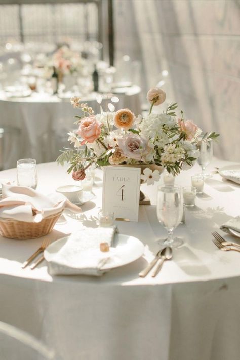 Romantic wedding tablescape featuring elegant table number cards & centerpieces in pastel hues | Midwest wedding, Omaha wedding planning, Nebraska wedding planner, luxury wedding planner, wedding inspo, wedding ideas, wedding reception decor, summer wedidng inspo, wedding tablescapes, wedding table decor, wedding table setting, wedding table centerpieces, wedidng menu, wedding stationery, wedding linens, modern romantic wedding, outdoor wedding, pink wedding theme, wedding details, dinner ideas Wedding Florals Round Table, Blush Pink Wedding Table Decor, Pastel Theme Wedding Decor, Summer Wedding Floral Centerpieces, Wedding Table Settings Candles, Wedding Table Circle, Wedding Table Decor Round Tables, Neutral Table Setting Wedding, Wedding Table Setting Ideas Elegant