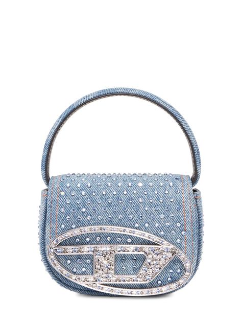 Find Diesel Xs 1dr Denim Crystals Top Handle Bag on Editorialist. Height: 9.5cm Width: 12.5cm Depth: 5cm. Strap drop: 52cm. Handle drop: 6cm. Detachable, adjustable strap. Single top handle. Front flap with magnetic closure. Embellished with crystals. Lined Denim Diesel, Bag Drawing, Diesel Bag, Diesel Denim, Washed Denim, Handle Bag, Magnetic Closure, Denim Wash, Top Handle